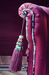 tassel on a luxury custom chair in red silk