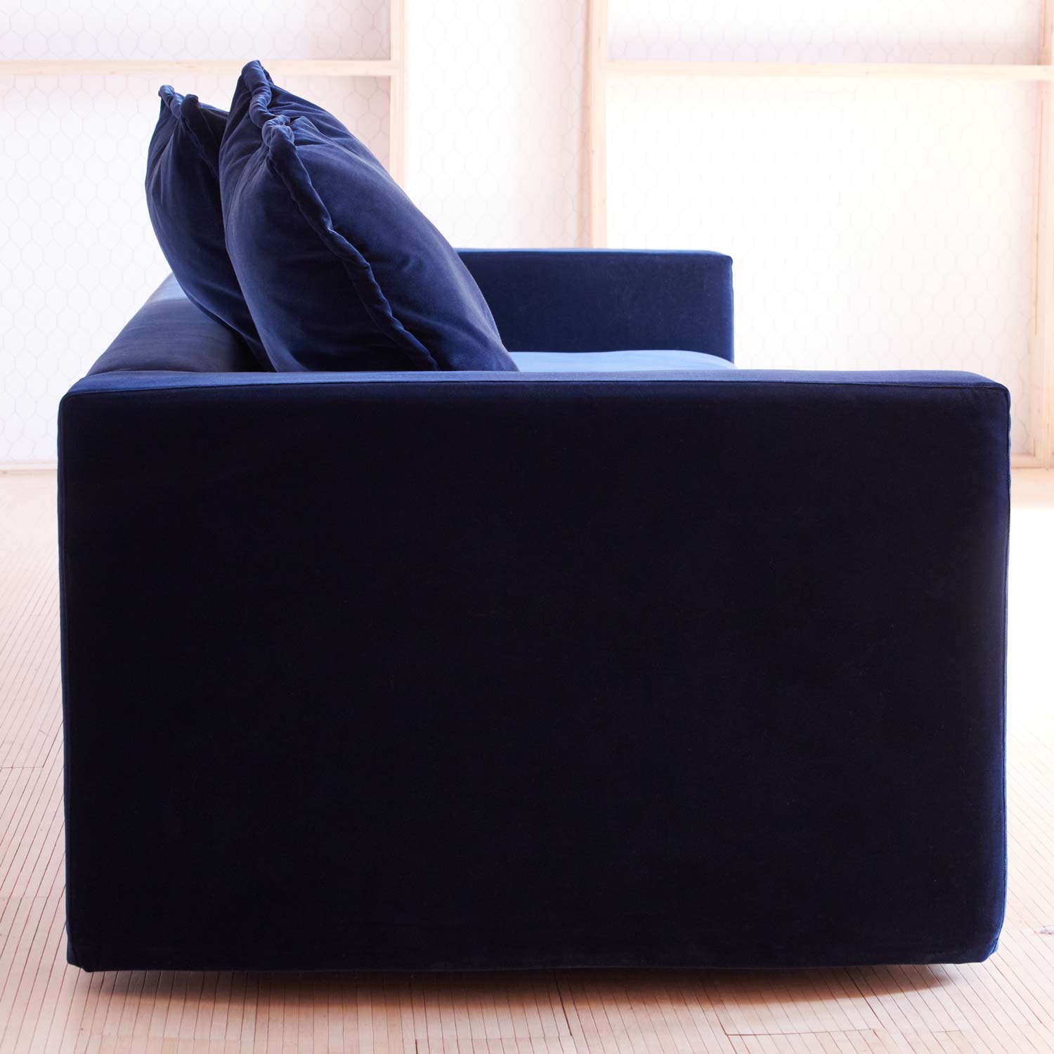 side view navy blue velvet couch