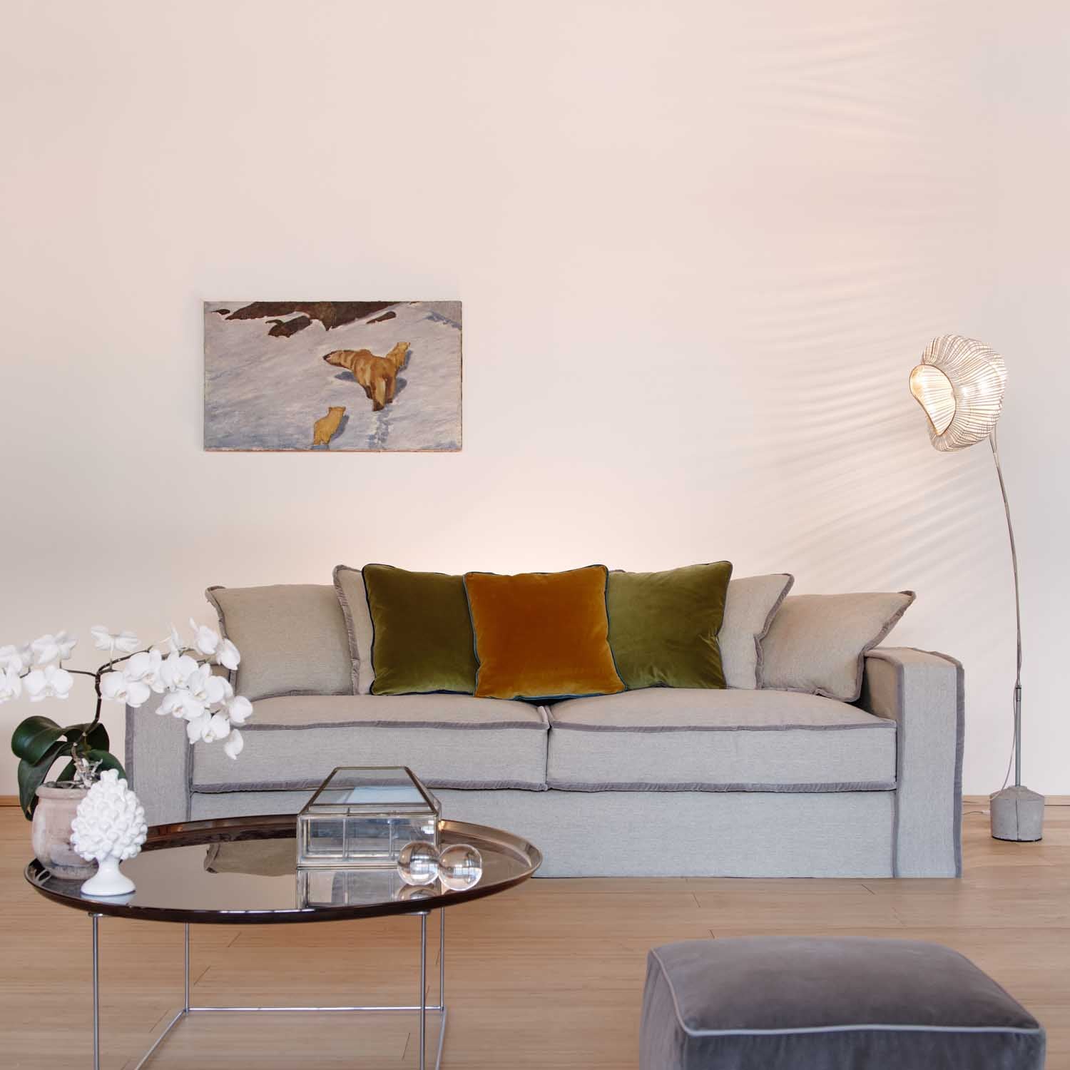 living room ambient with deep seated luxury sofa in beige and grey.