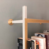 gold and white bookshelf system
