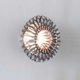 Unique Artisanal Design: Recycled Metal Wall Lamp