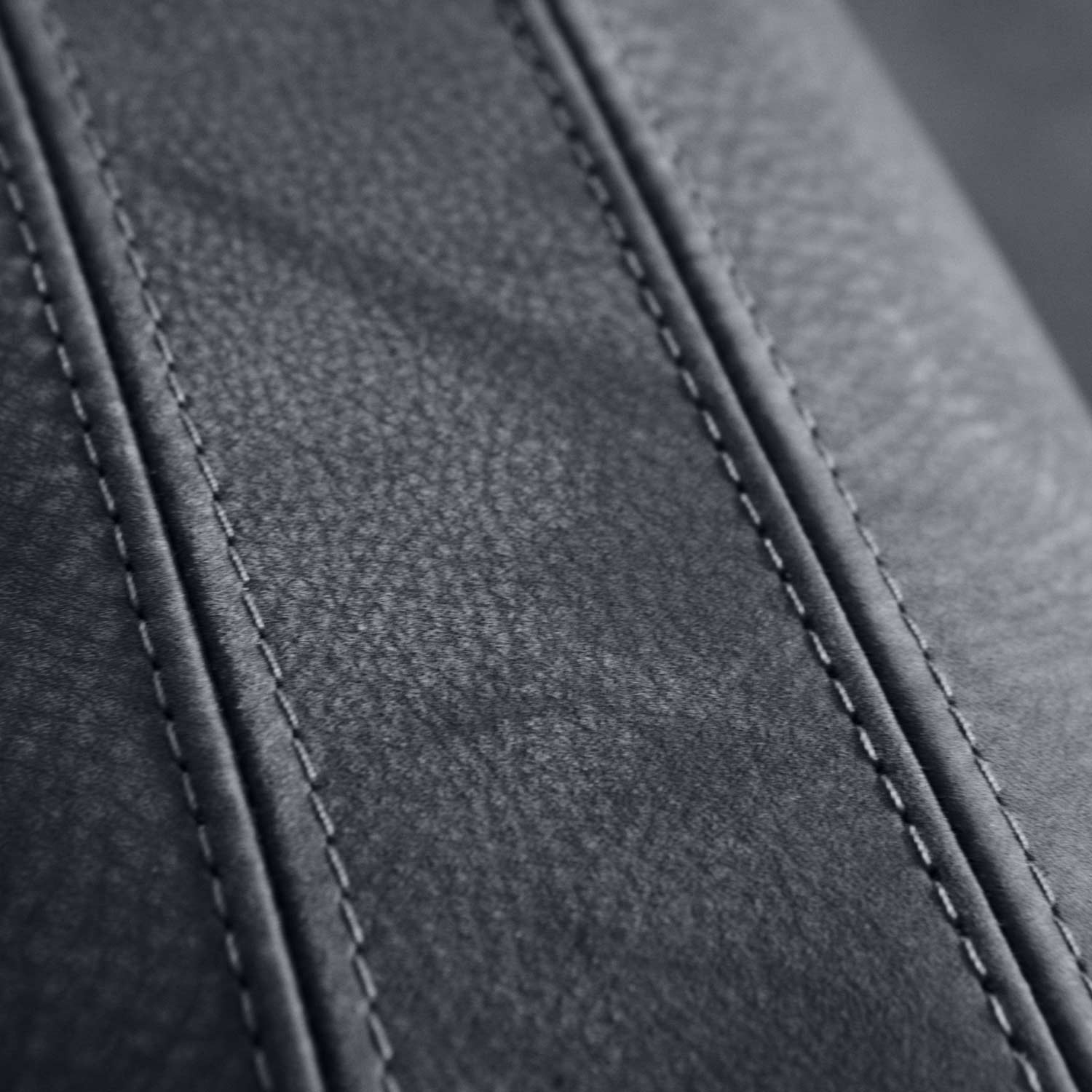 contrasting stitching on armrest of traco armchair