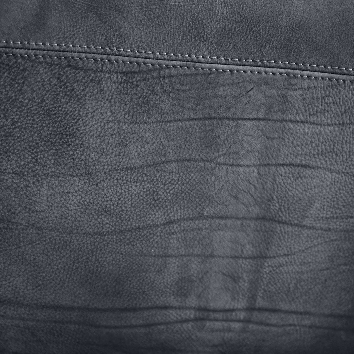 stitching detail on leather armchair