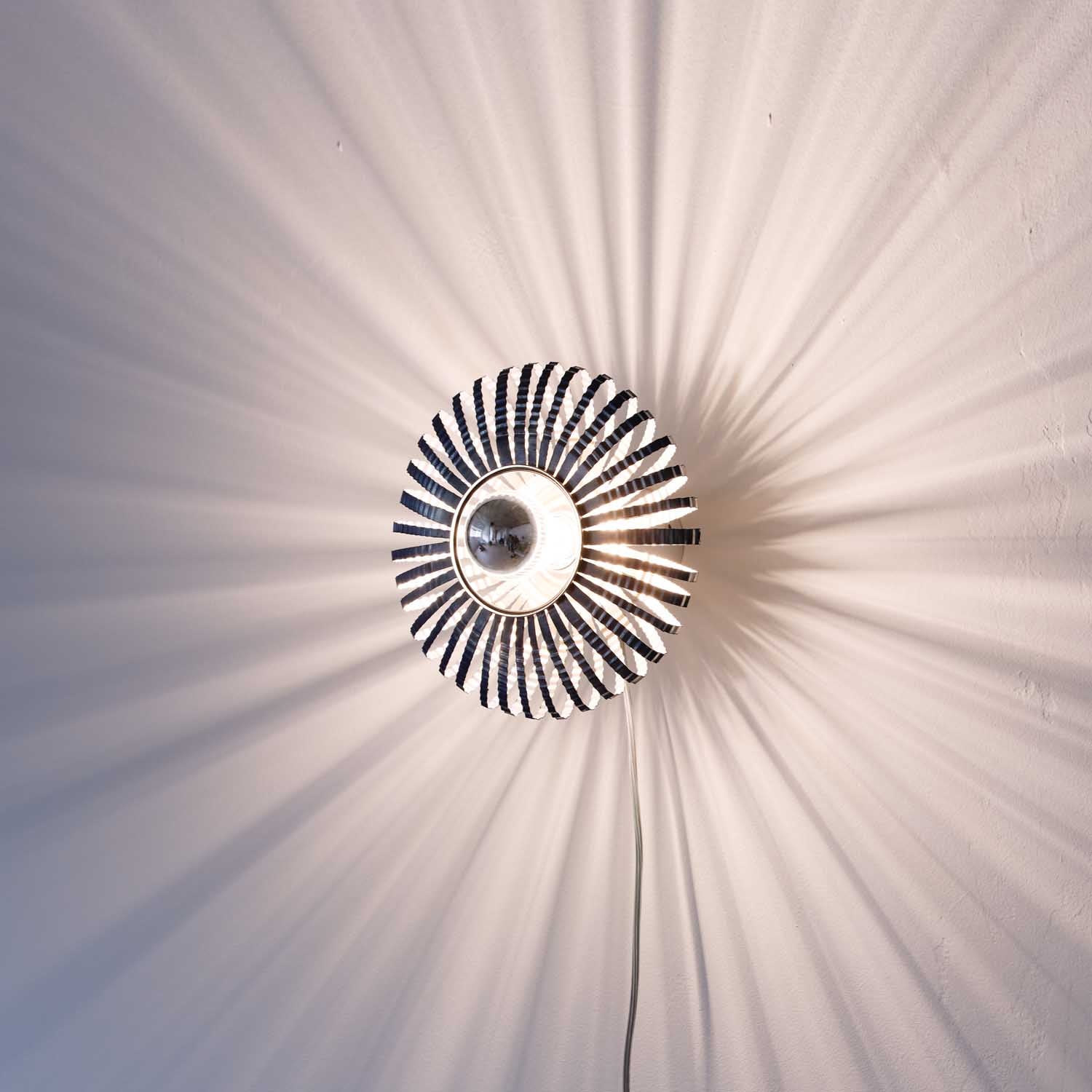Eco-Friendly Brilliance: Recycled Metal Celeste Wall Light
