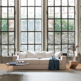 Deep Seats for a Pleasurable Seating Experience. Rafaella sofa in front of industrial window.