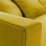 yellow cotton armrest on sofa