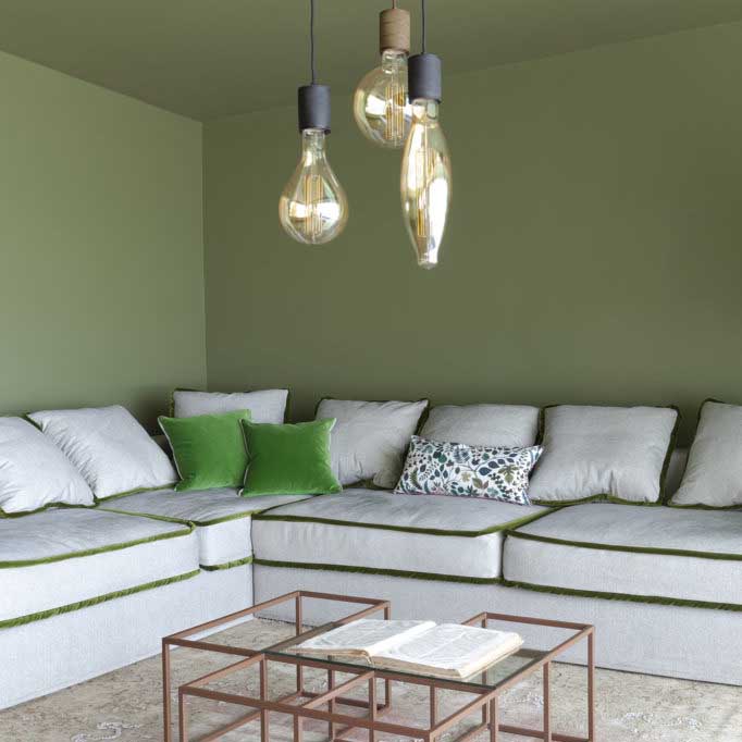 green living room linen sofa in natural textiles