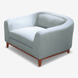 Leisure and Comfort Combined, green armchair side view