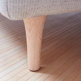 Elegant wooden feet in natural oak finish.